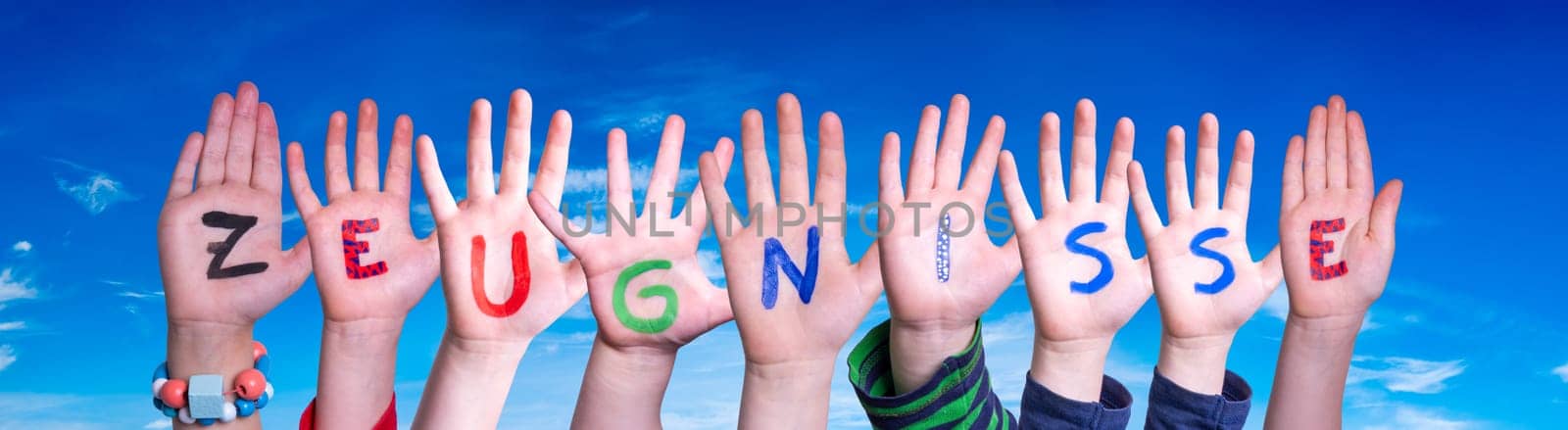 Children Hands Building Colorful German Word Zeugnisse Means School Reports. Blue Sky As Background.