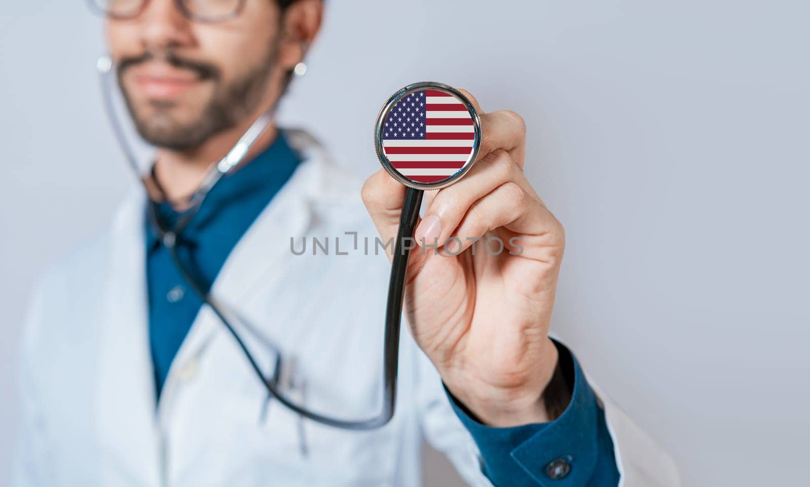 USA flag on stethoscope. Doctor holding stethoscope with USA flag, Doctor showing stethoscope with usa flag