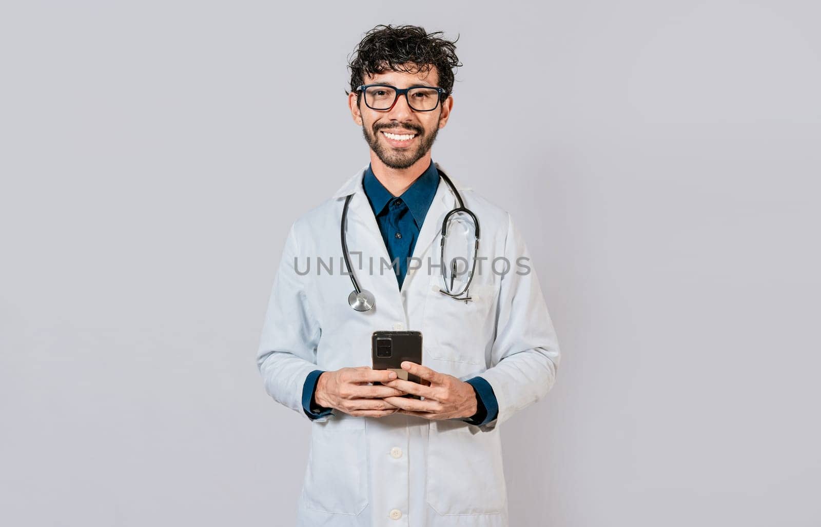 Happy doctor with phone on isolated background. Smiling doctor using cellphone isolated, Young doctor with phone isolated