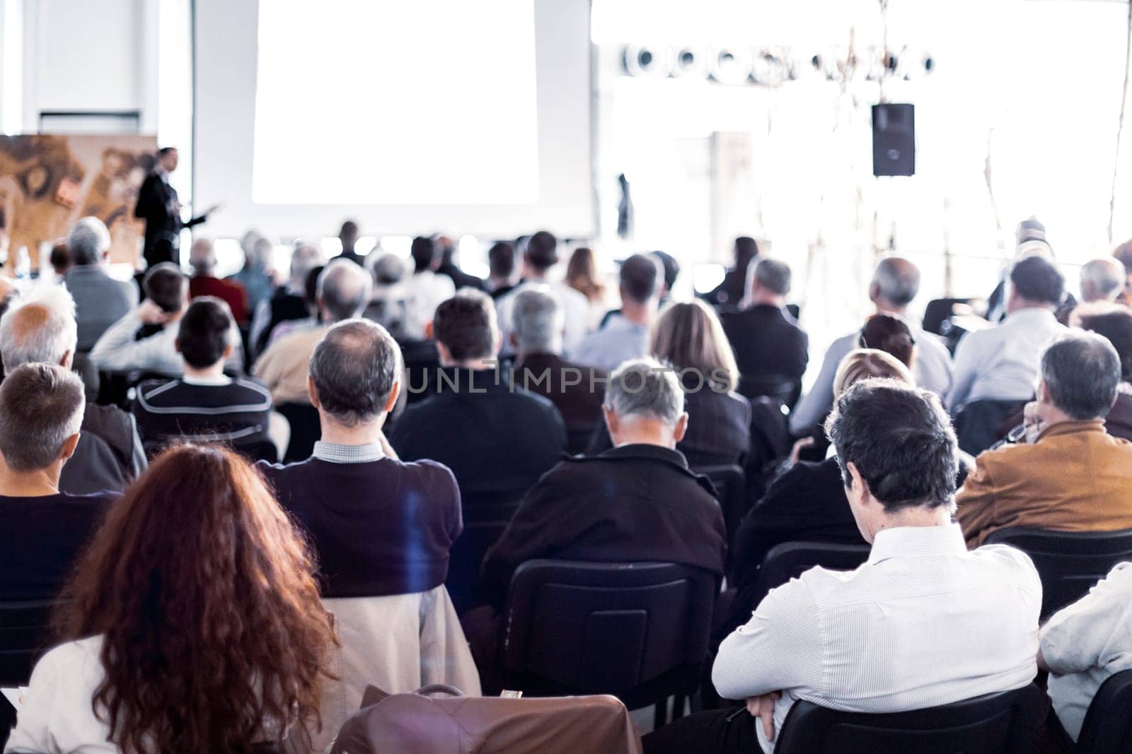 Speaker Giving a Talk at Business Meeting. Audience in the conference hall. Business and Entrepreneurship.
