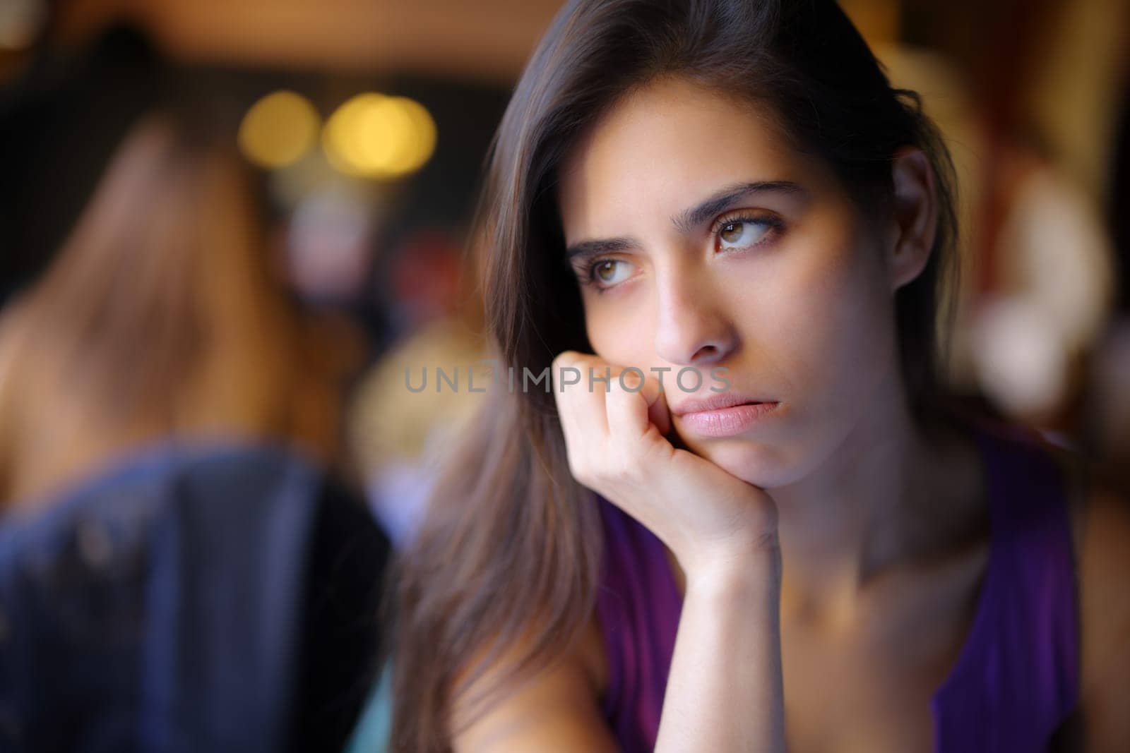 Bored woman waiting in a restaurant interior