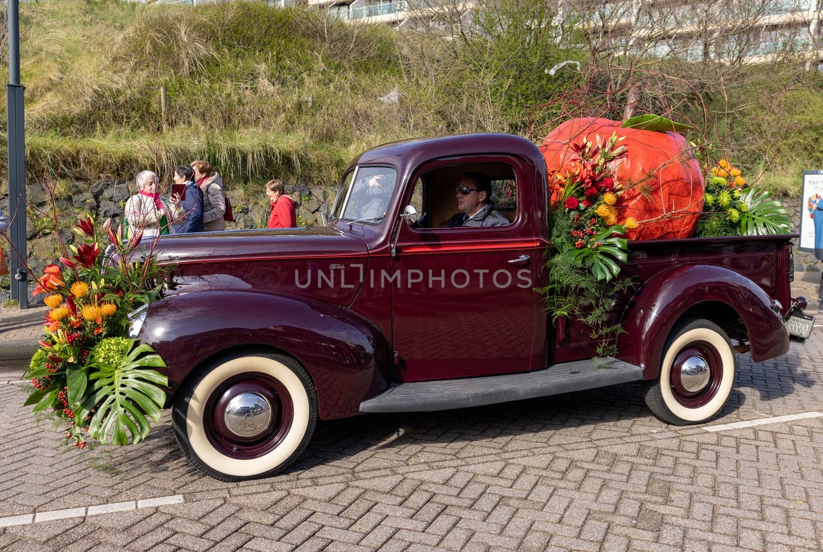 Noordwijk, Netherlands - April 22, 2023: Cars decorated with flowers taking part in the Bloemencorso Bollenstreek the annual spring flower parade from Noordwijk to Haarlem in the Netherlands.
