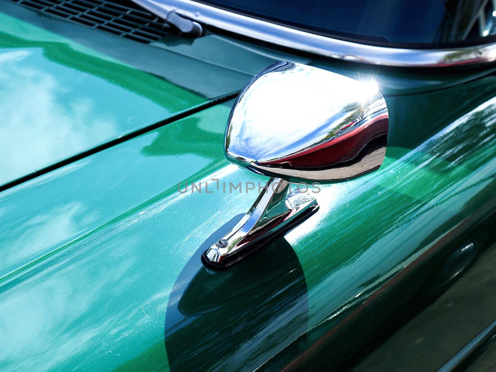Sideview mirror of an old vintage car, conceptual vintage background with space for text