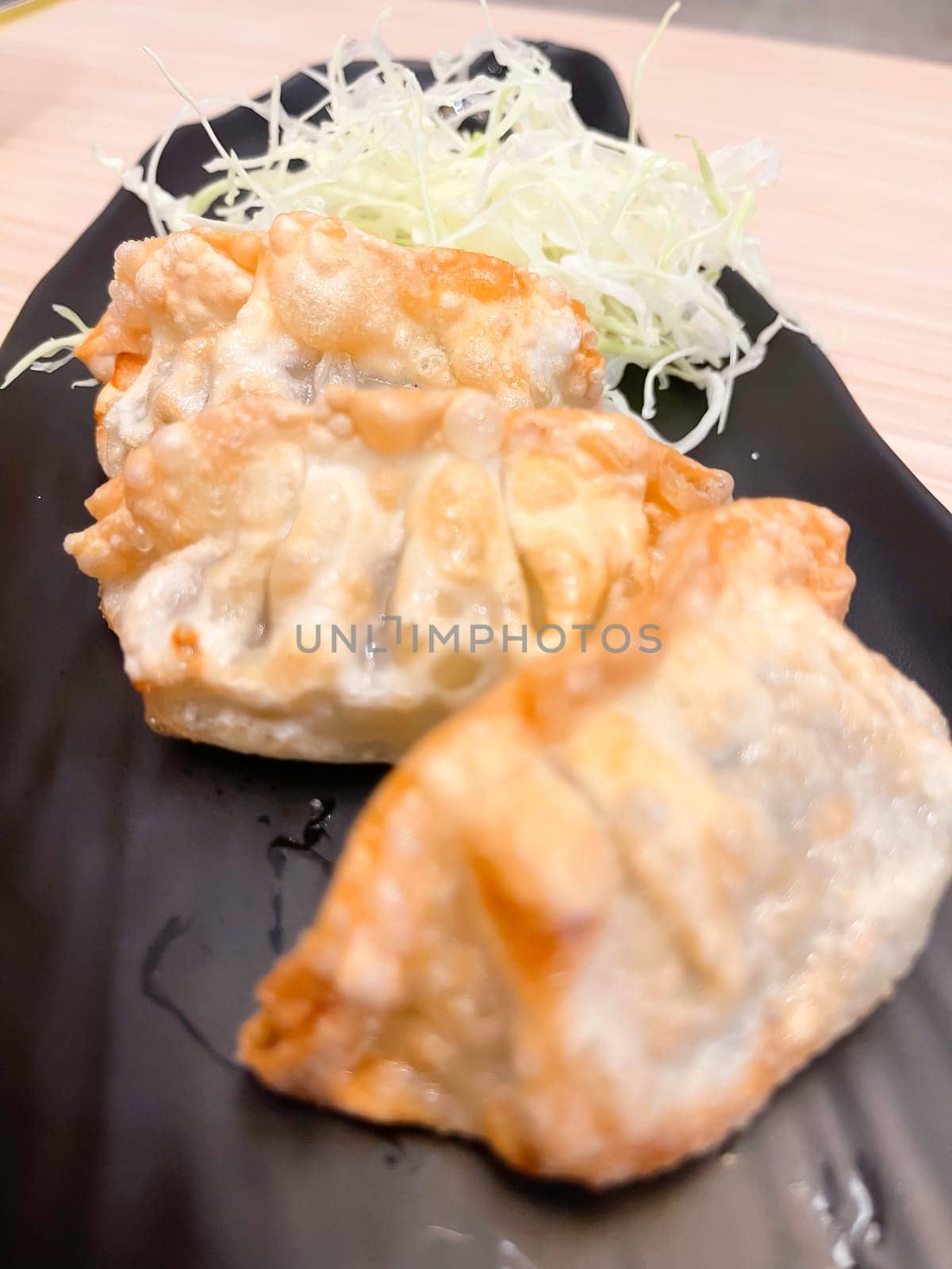 Japanese Pan-fried gyoza dumpling with soy sauce, stock photo
