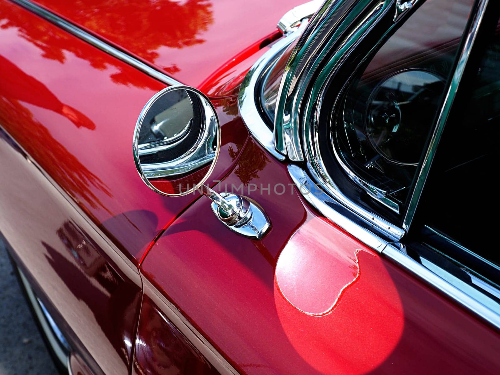 Sideview mirror of an old vintage car, conceptual vintage background with space for text