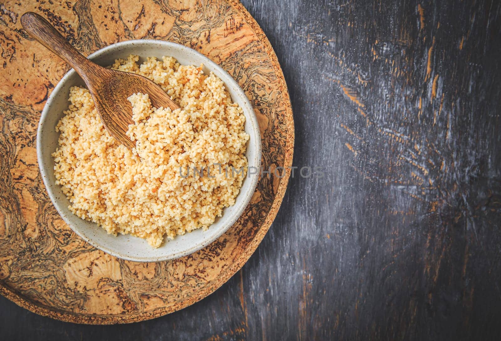 Freshly cooked bulgur in bowl. Bulgur wheat grains.