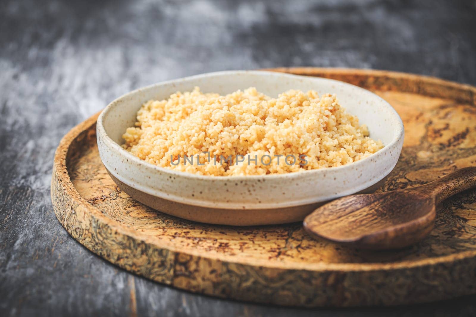 Freshly cooked bulgur in bowl. Bulgur wheat grains.