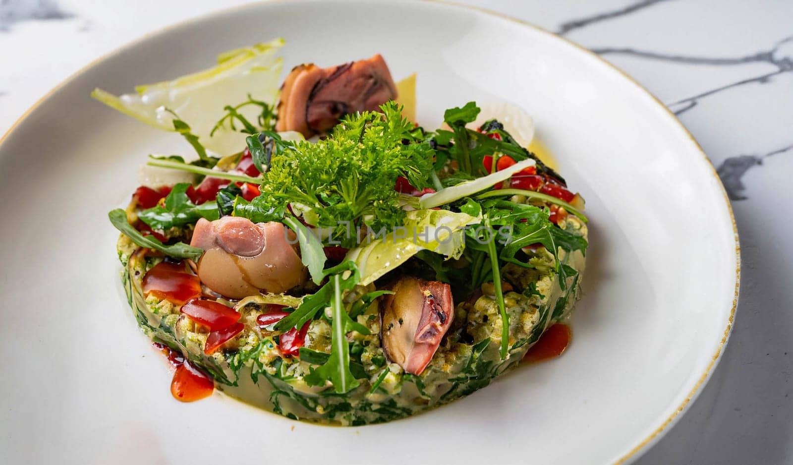 macro photo Sarapeteu garnished with greens in a plate on a white marble serving table