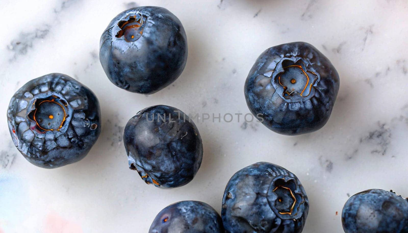 Top view blueberries antioxidant superfood on white marble background. Laid out randomly