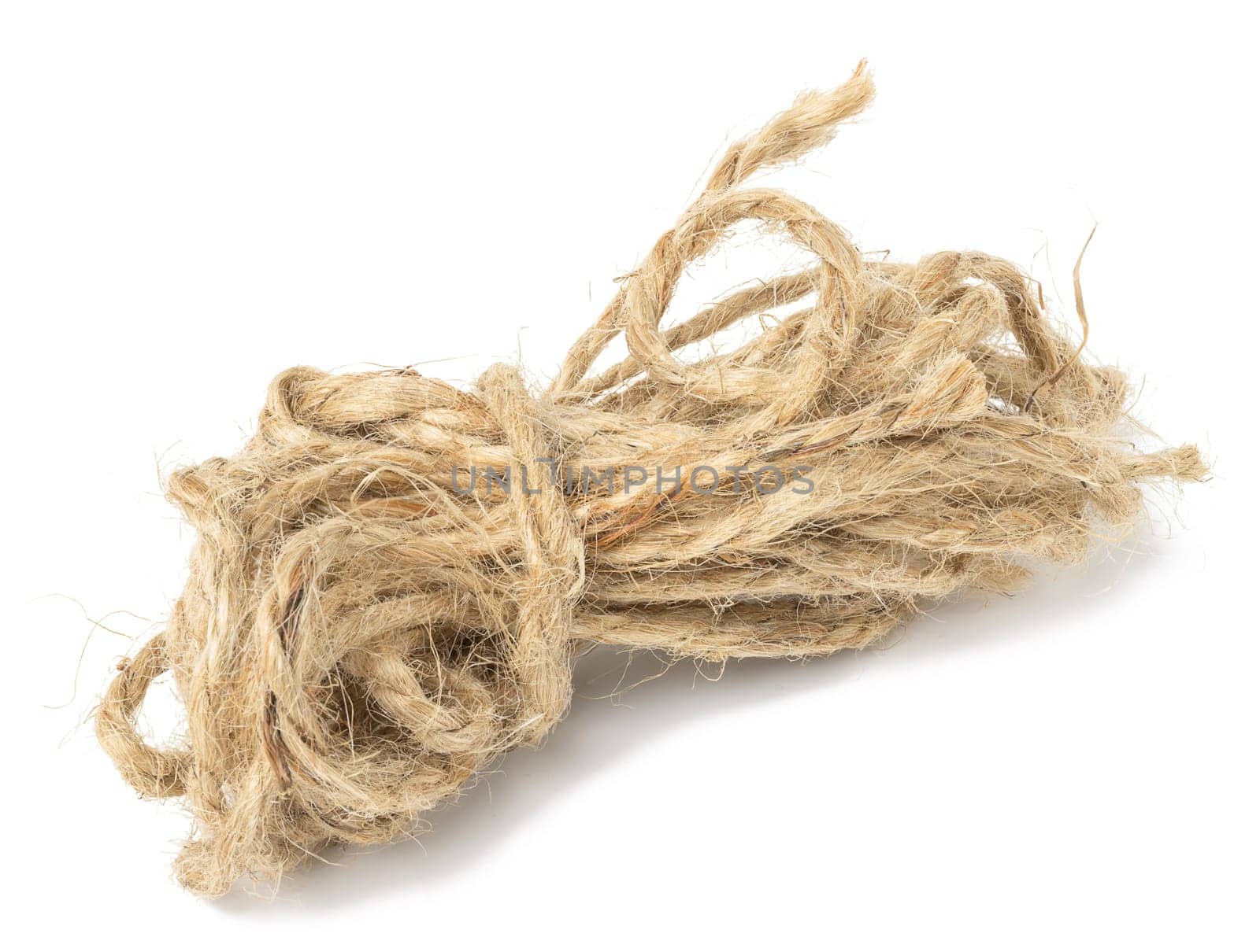 Brown twine rope on a white isolated background, top view. Packing natural