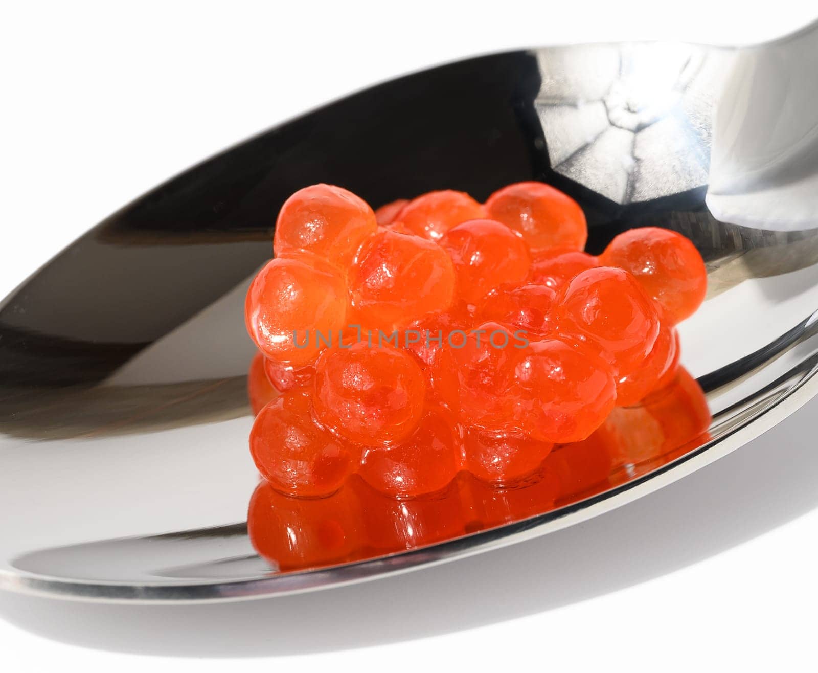 Red sturgeon caviar in a metal spoon, delicious snack