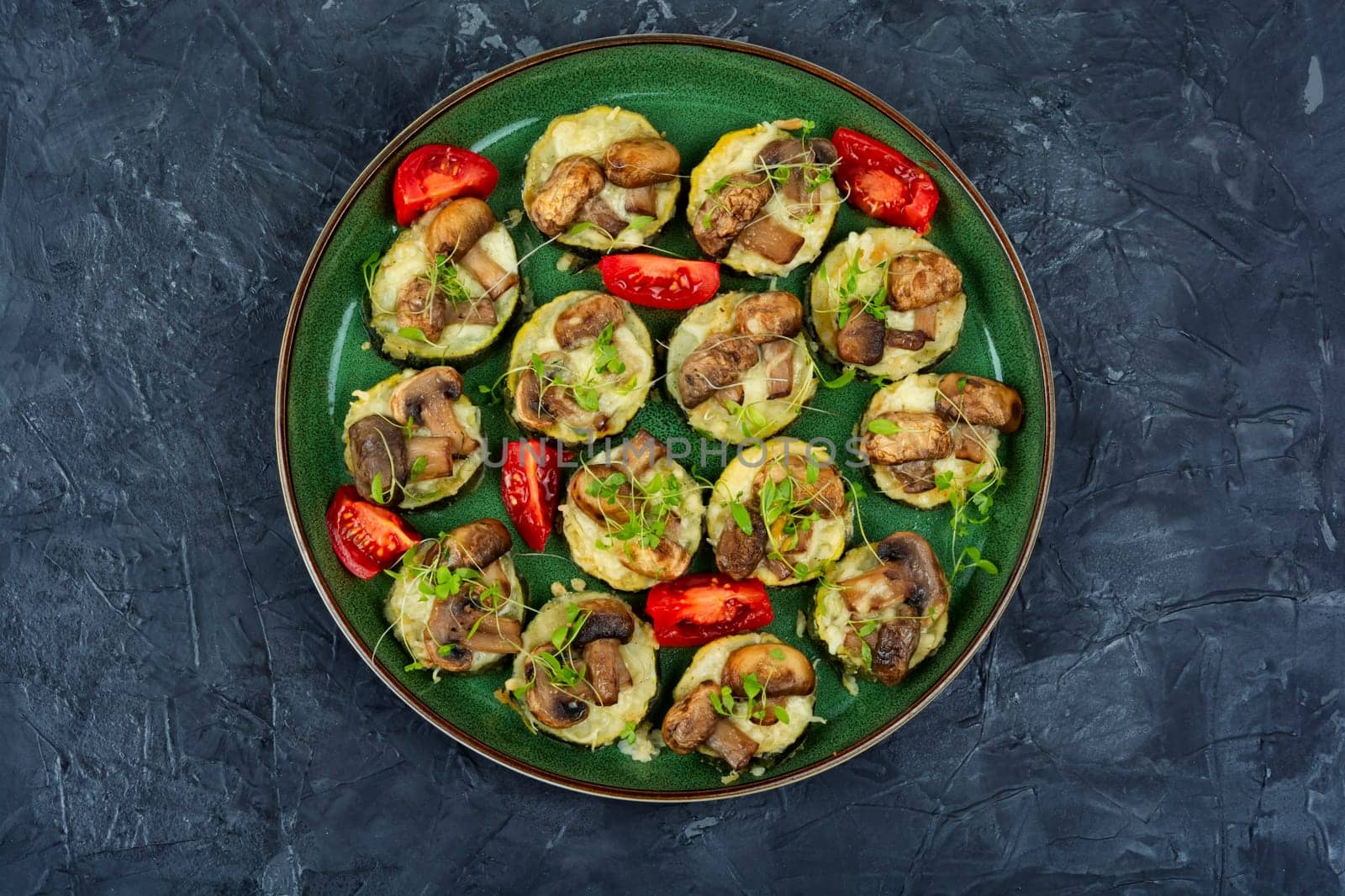 Diet food-fried zucchini with mushrooms and herbs. Roasted vegetables mix