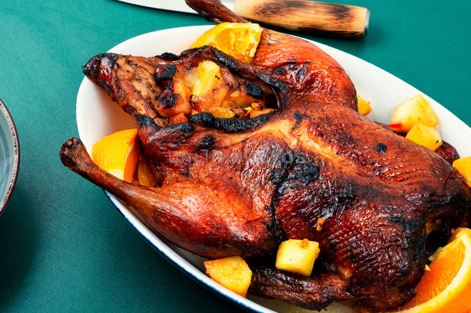 Roast duck stuffed orange and caramelized apples.