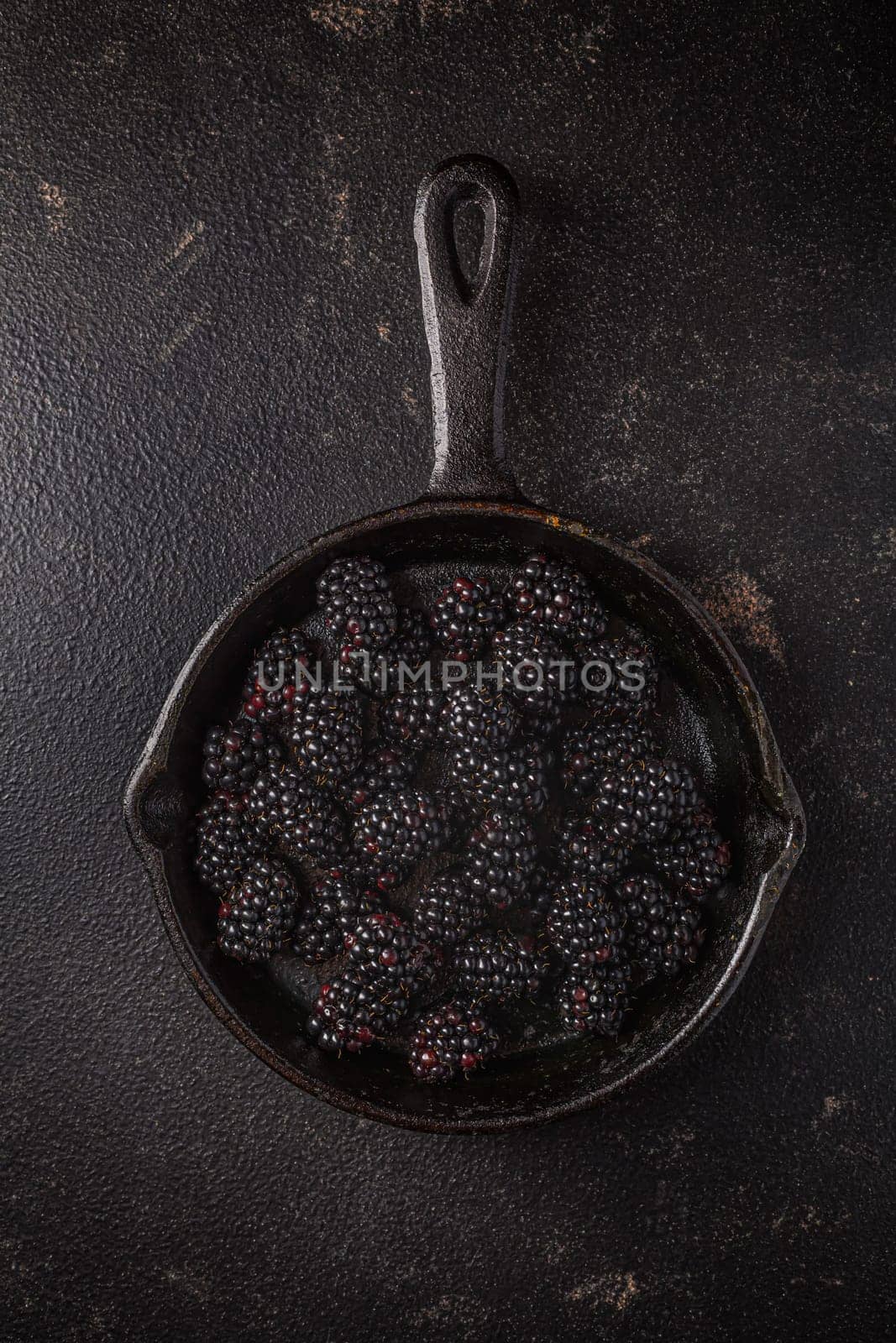 Organic blackberries in baking forms, ripe blackberries