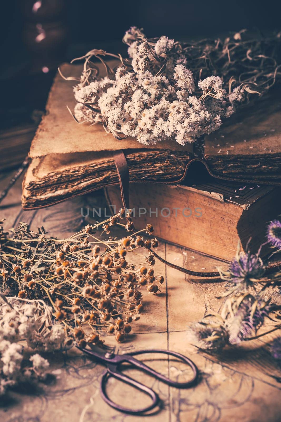 Dry flowers bouquets with old vintage diary and books, nostalgic vintage background