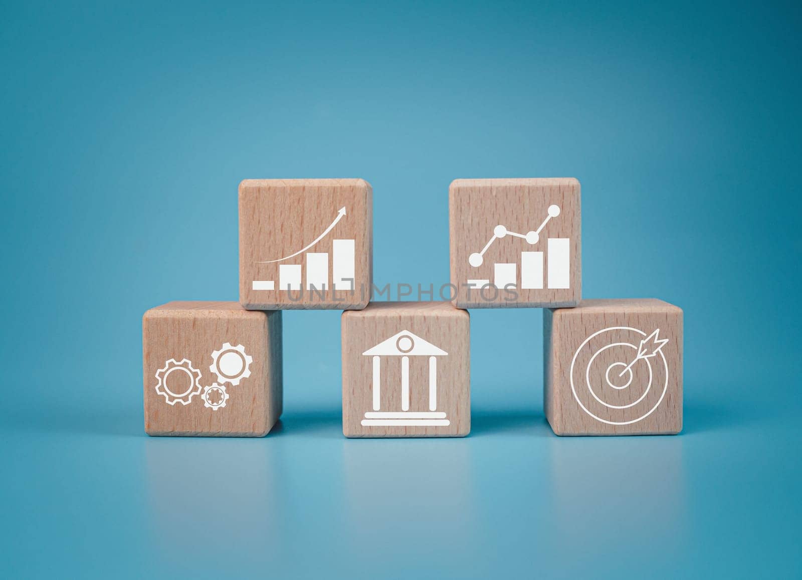 Wood cube block stacking with icon.Concept of business strategy and goal action plan.