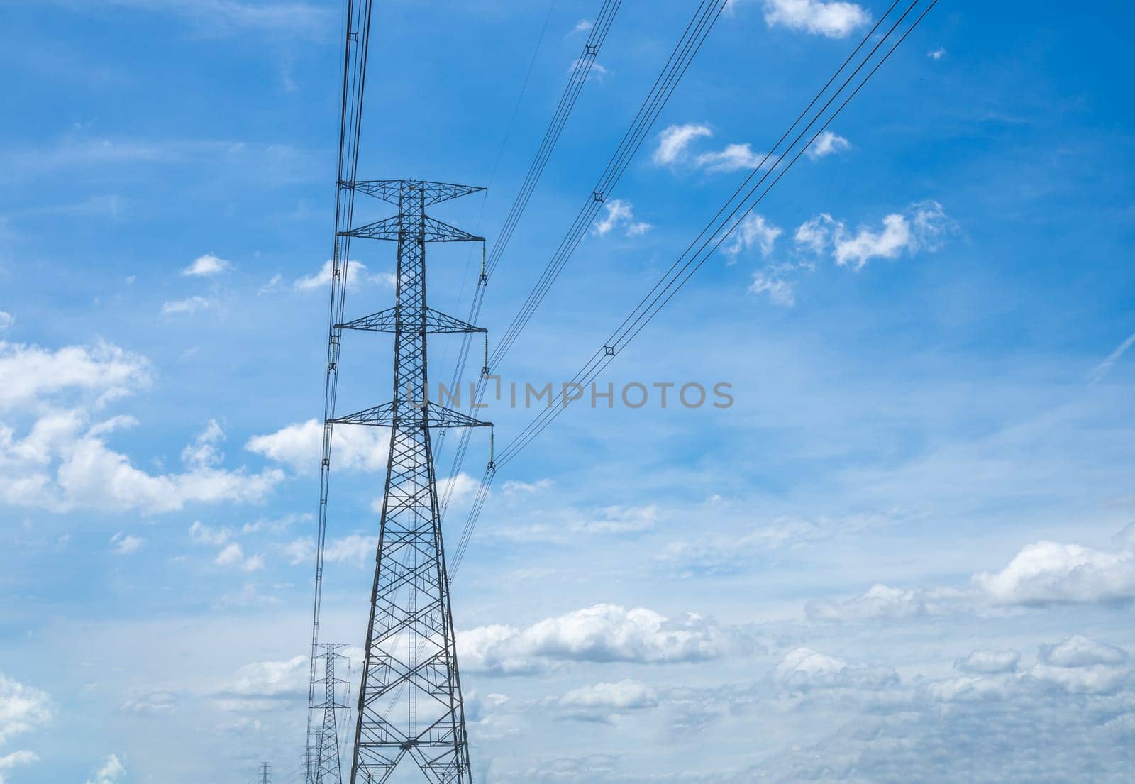 High voltage lamp post on a background of sky and clouds.