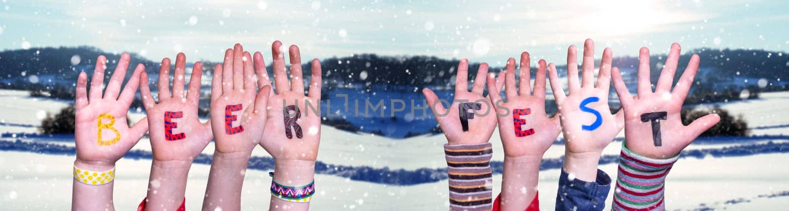 Children Hands Building Colorful English Word Beer Fest. White Winter Background With Snowflakes And Snowy Landscape.
