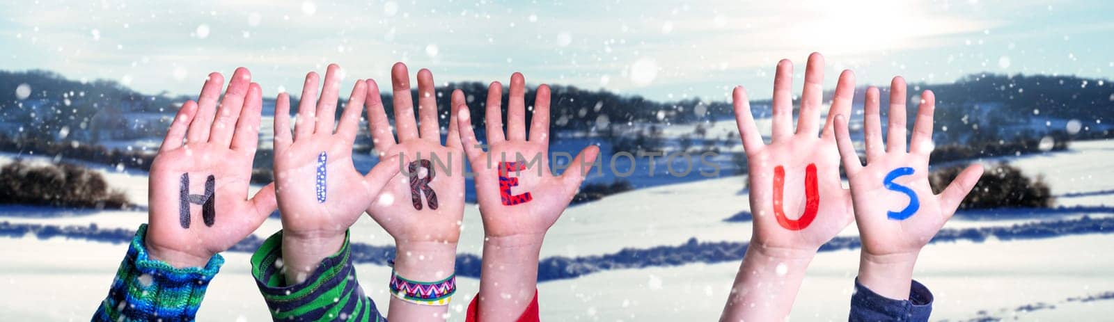 Children Hands Building Colorful English Word Hire Us. White Winter Background With Snowflakes And Snowy Landscape.