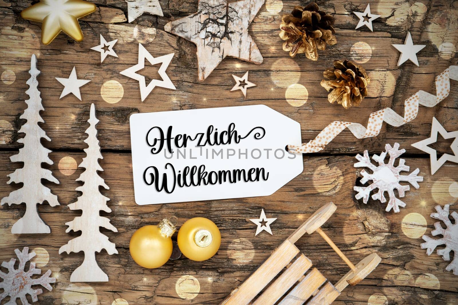 Rustic Wooden Bokeh Christmas Background, Winter Decoration With Label With German Text Herzlich Willkommen, Which Means Welcome In English