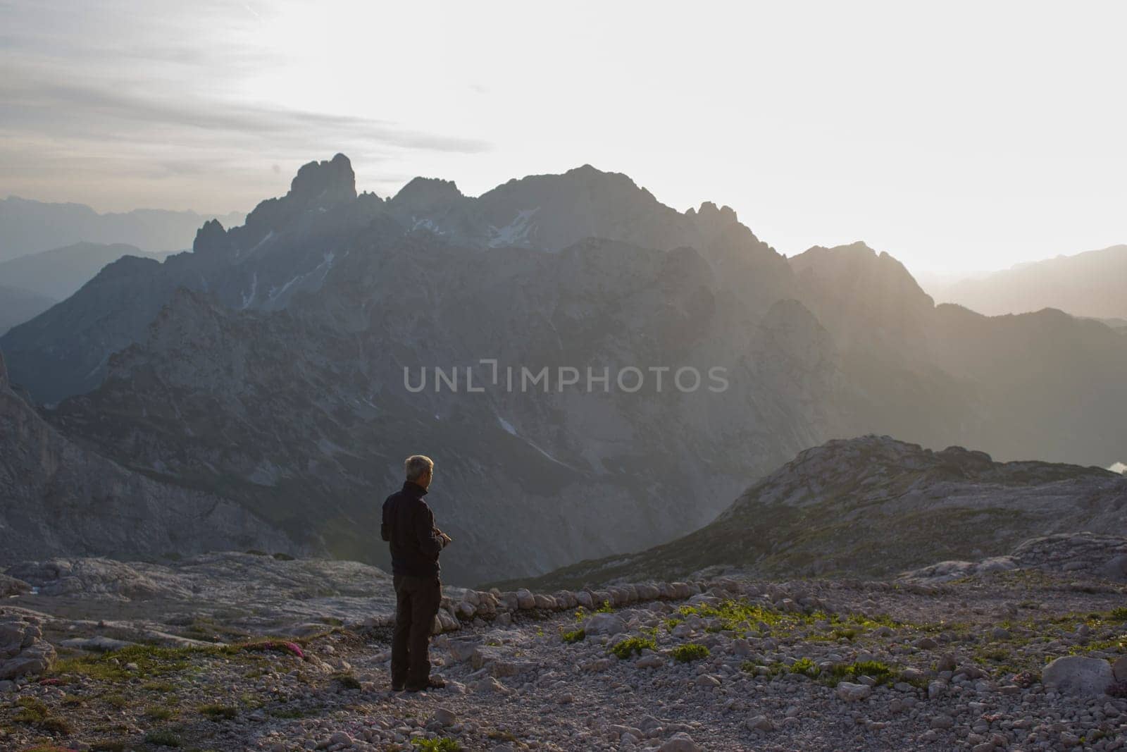 Sunset - Panorama of massive Alpine mountains. Landscape in the Austrian Alps of the Dachstein region (Styria in Austria)
