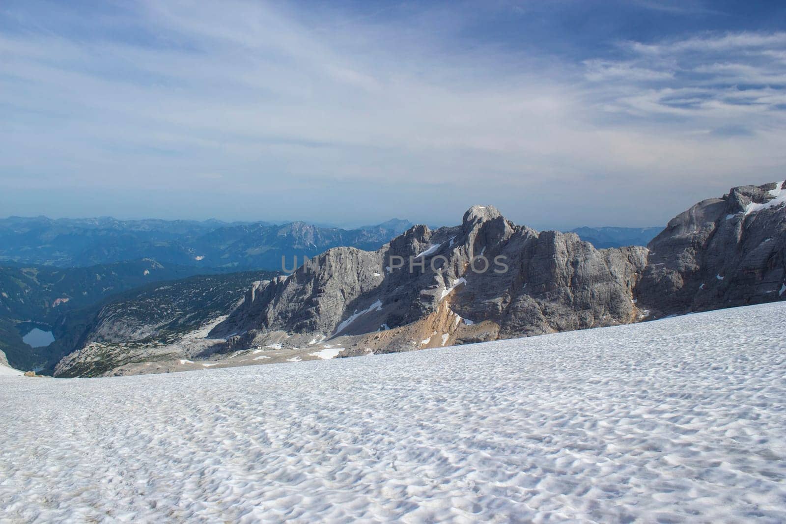 Panorama of massive Alpine mountains. Landscape in the Austrian Alps of the Dachstein region (Styria in Austria) - view from Dachstein