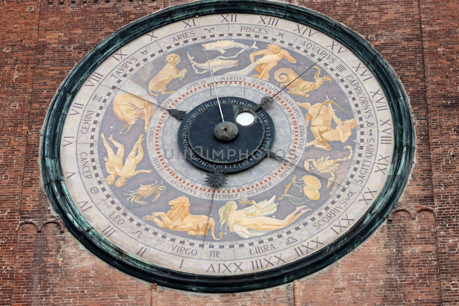 Clock on the Medieval Bell Tower of Cremona known as the Torrazzo, Lombardy, Italy.