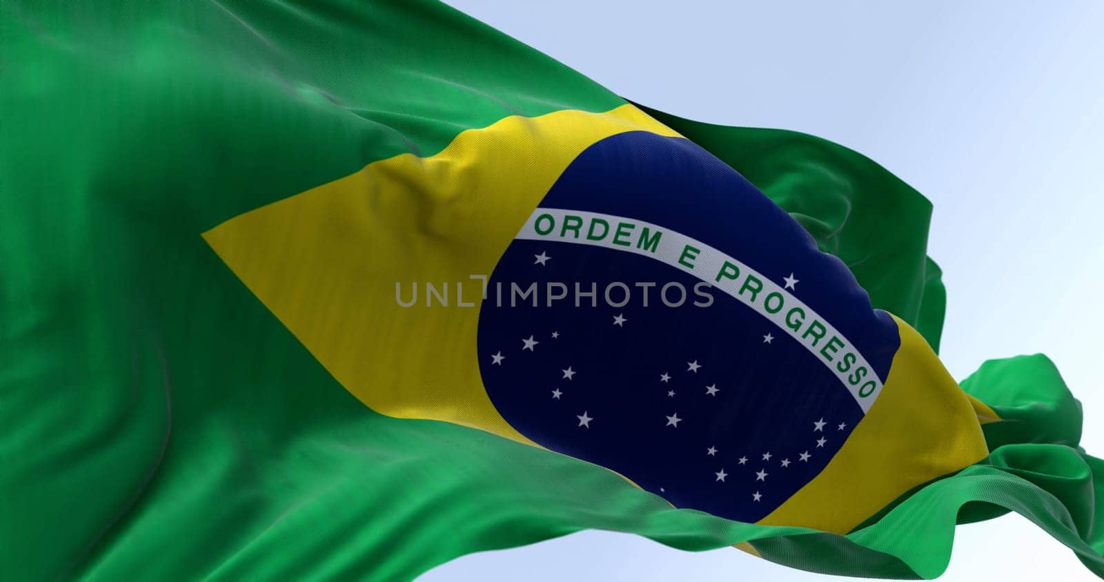 Close-up of Brazil national flag waving in the wind. Yellow diamond on green field with blue circle of 27 white, five-pointed stars. South American country. 3d illustration render. Fluttering fabric.
