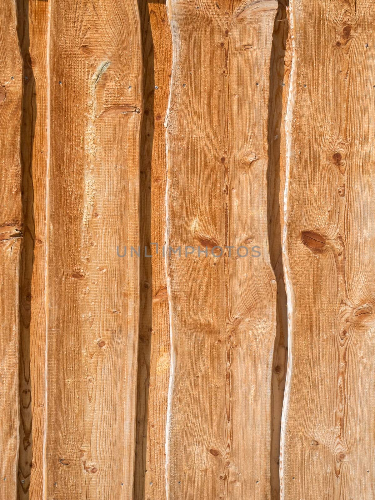 Format-filling view of a sheet piling in vertical orientation and lateral sunlight.