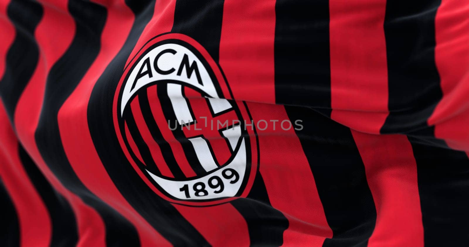 Milan, Italy, July 23 2023: Close-up of Flag of A.C. Milan waving. Professional football club based in Milan, Italy. Illustrative editorial 3d illustration render. Waving fabric.