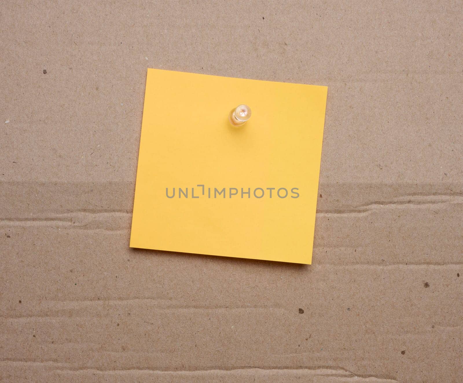 Yellow paper blank stickers attached with a button, space for notes and labels