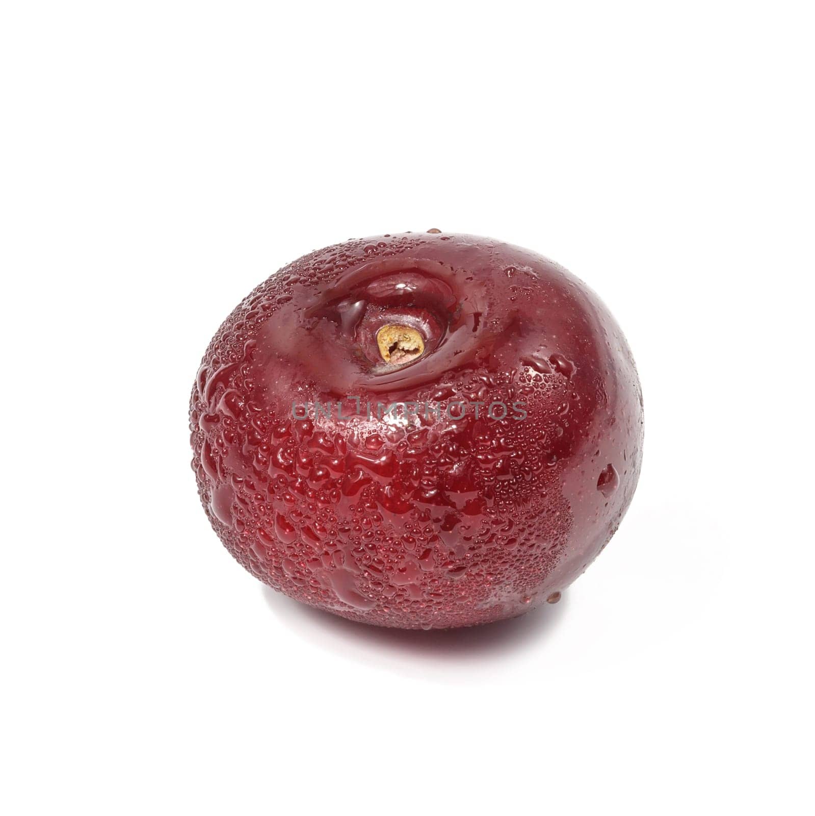 Ripe red cherry on a white isolated background