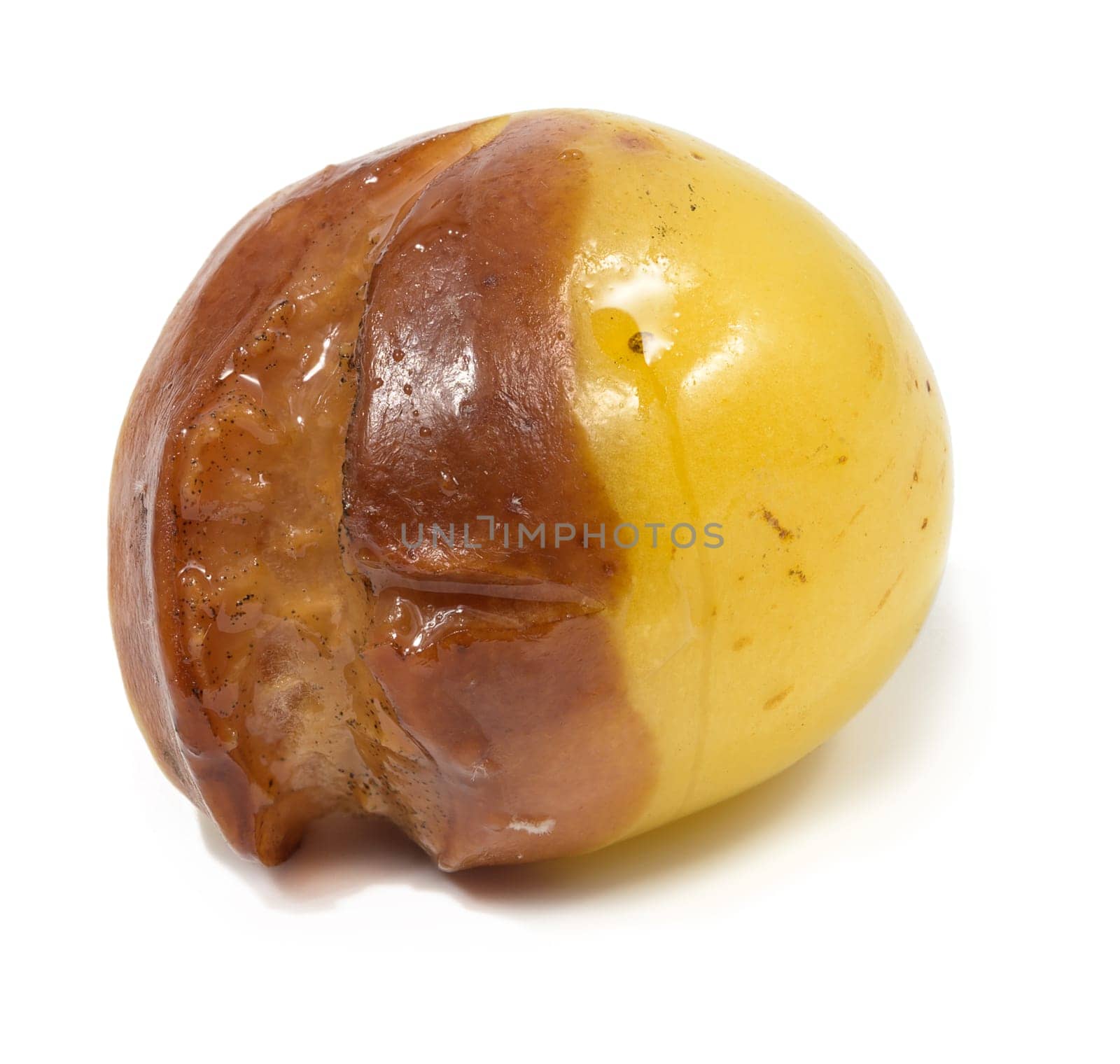 Yellow rotten sweet cherry on a white isolated background