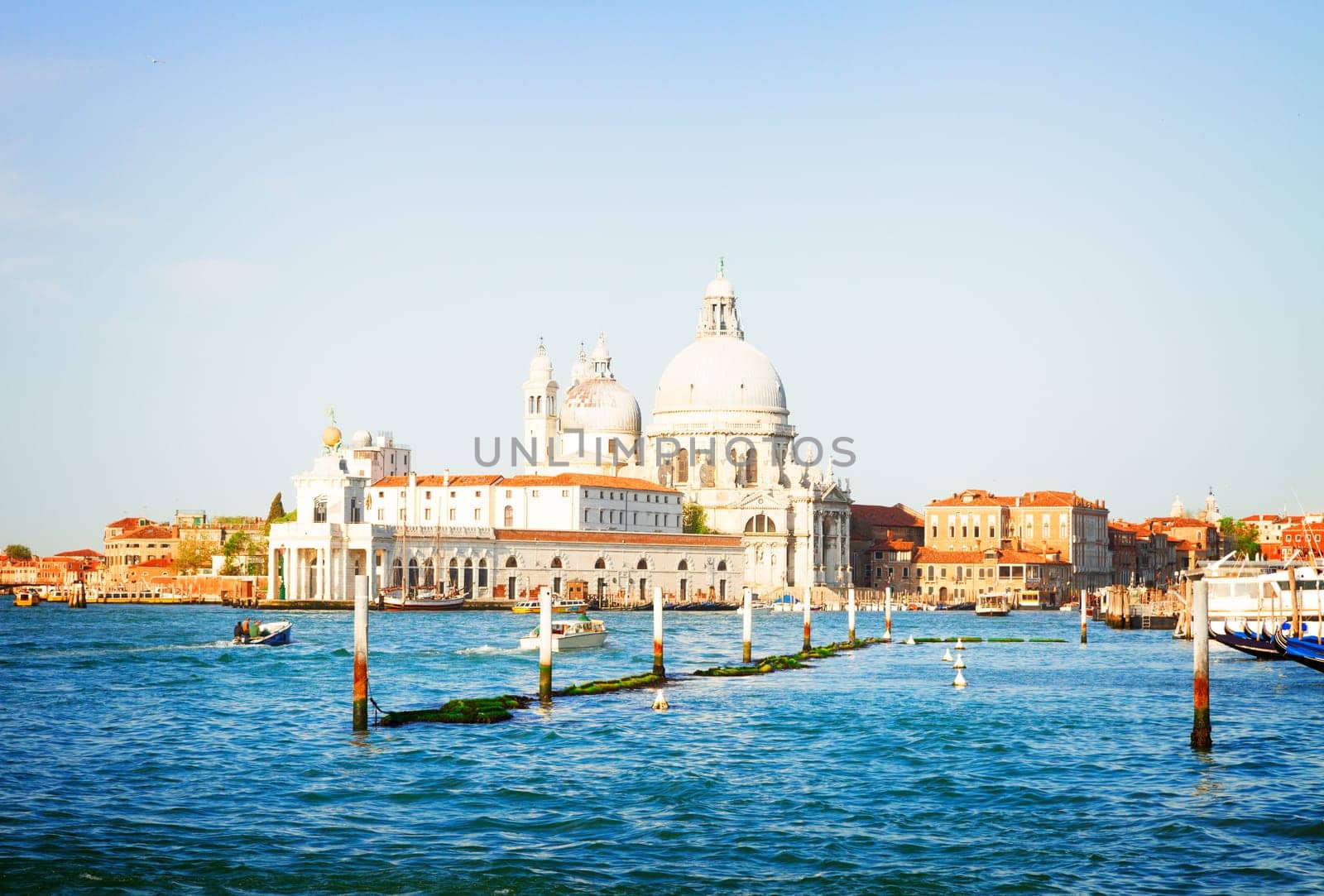 Basilica Santa Maria della Salute over  Grand canal water at sunny day, Venice, Italy, retro toned
