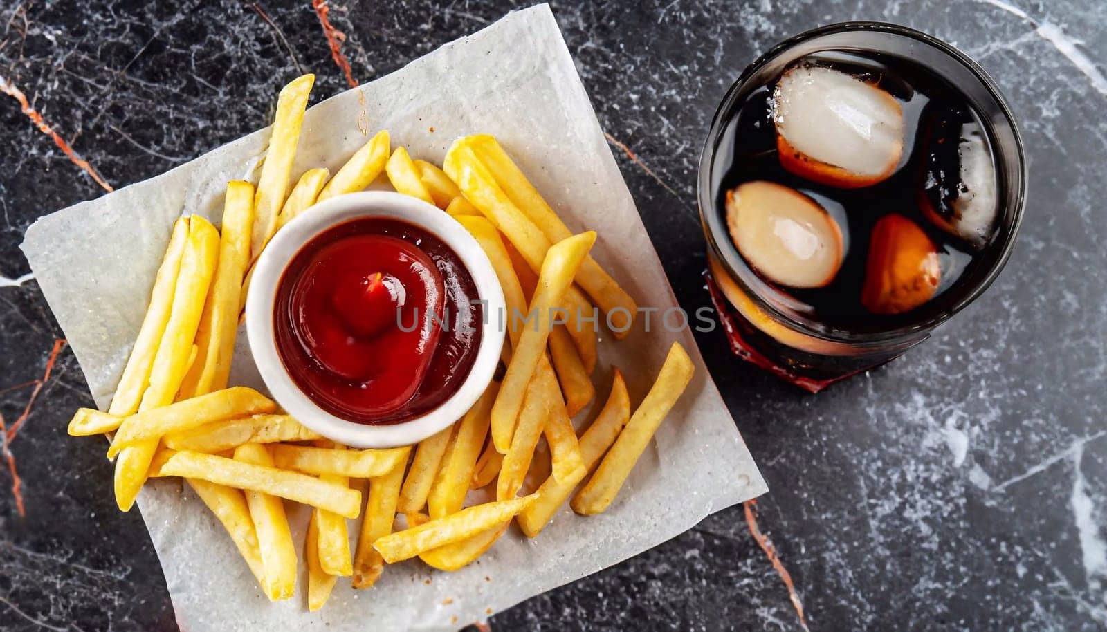 plate of french fries on a wooden table