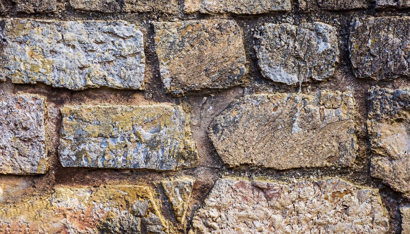 Texture of a stone wall. Old castle stone wall texture background. Stone wall as a background or texture. Part of a stone wall, for background or texture