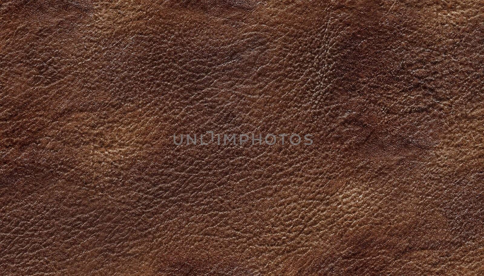 dark brown leather texture closeup can be used as background.
