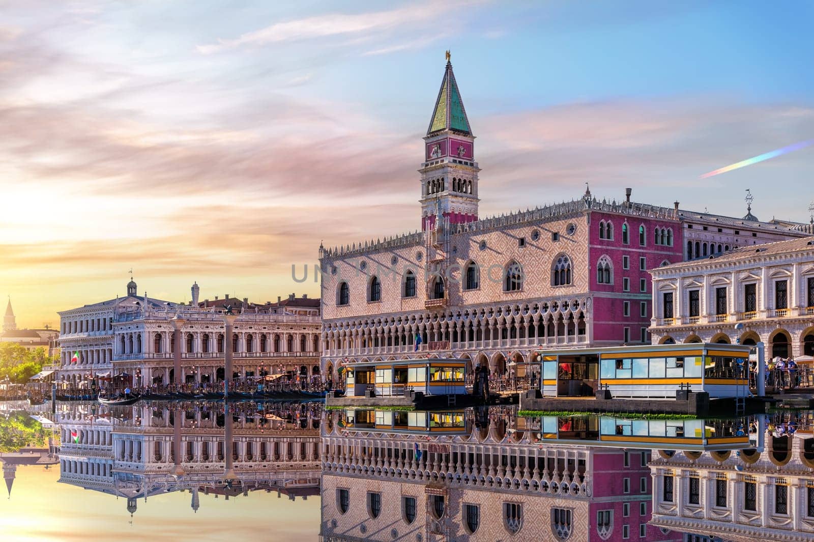 View of the Venice lagoon, San Marco and Doge's Palace at sunset sky, Italy.