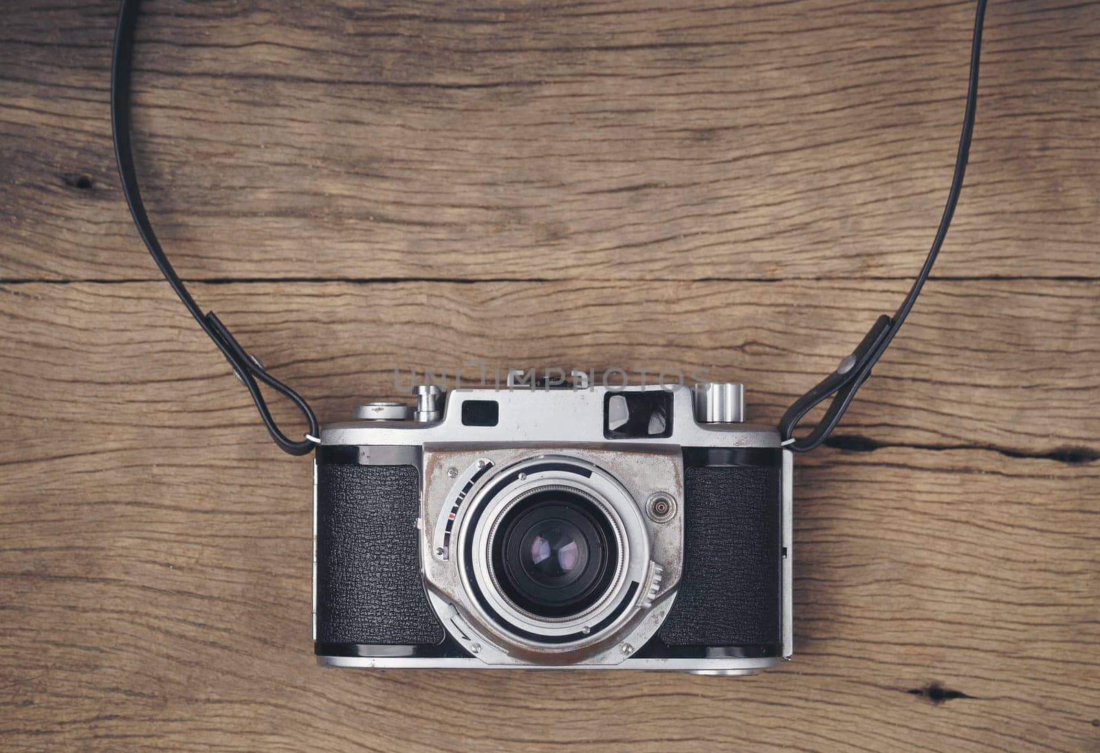vintage old film camera on wood board with copy space