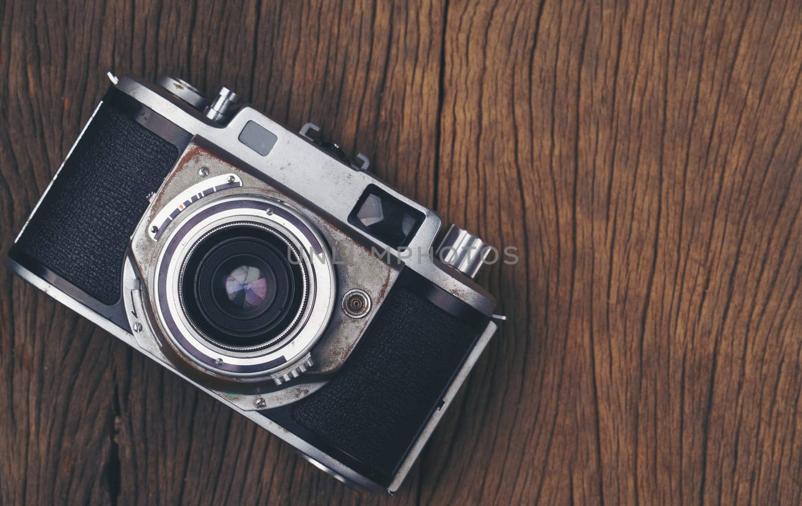 vintage old film camera on wood board with copy space