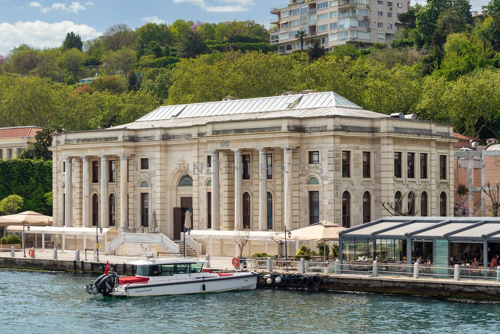 Istanbul, Turkey - May 8 2023: Morning view in a spring day of Kabatas Boys High School, Kabatas Erkek Lisesi Egitim Vakfi building, suited by Bosphorus Strait in Ortakoy, Besiktas, Istanbul, Turkey