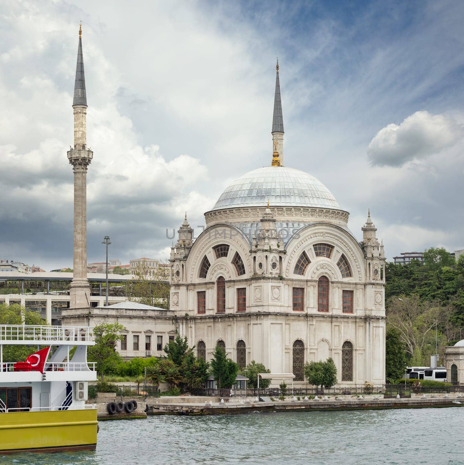View from Bosphorus strait overlooking Baroque style Dolmabahce Mosque, located at the waterside of Kabatas, in Beyoglu district, Istanbul, Turkey