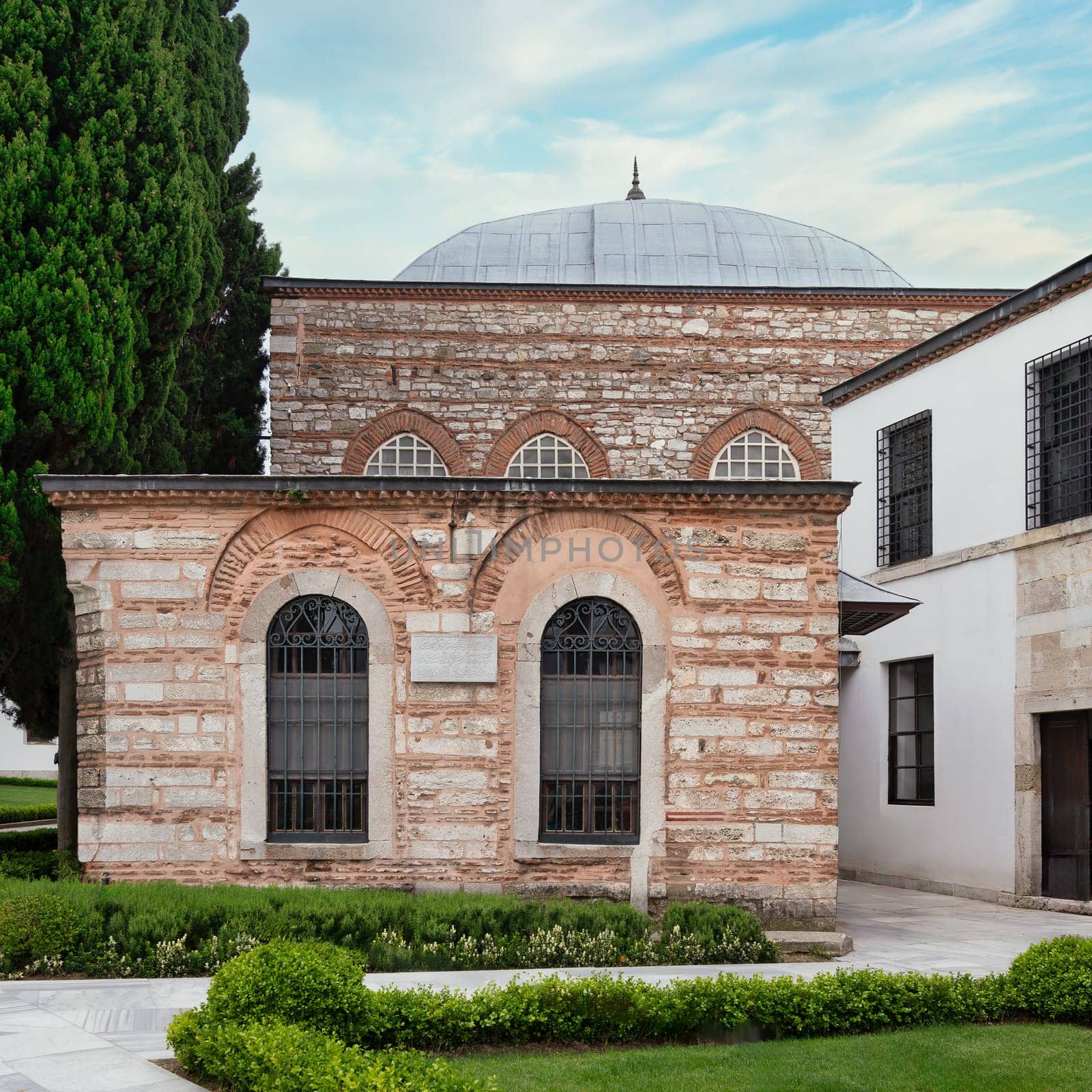 Back facade of 16th century Agalar Mosque, a small mosque within the Topkapi Palace complex, Istanbul, Turkey, built by Ottoman sultan Suleiman the Magnificent, constructed of of red and white bricks