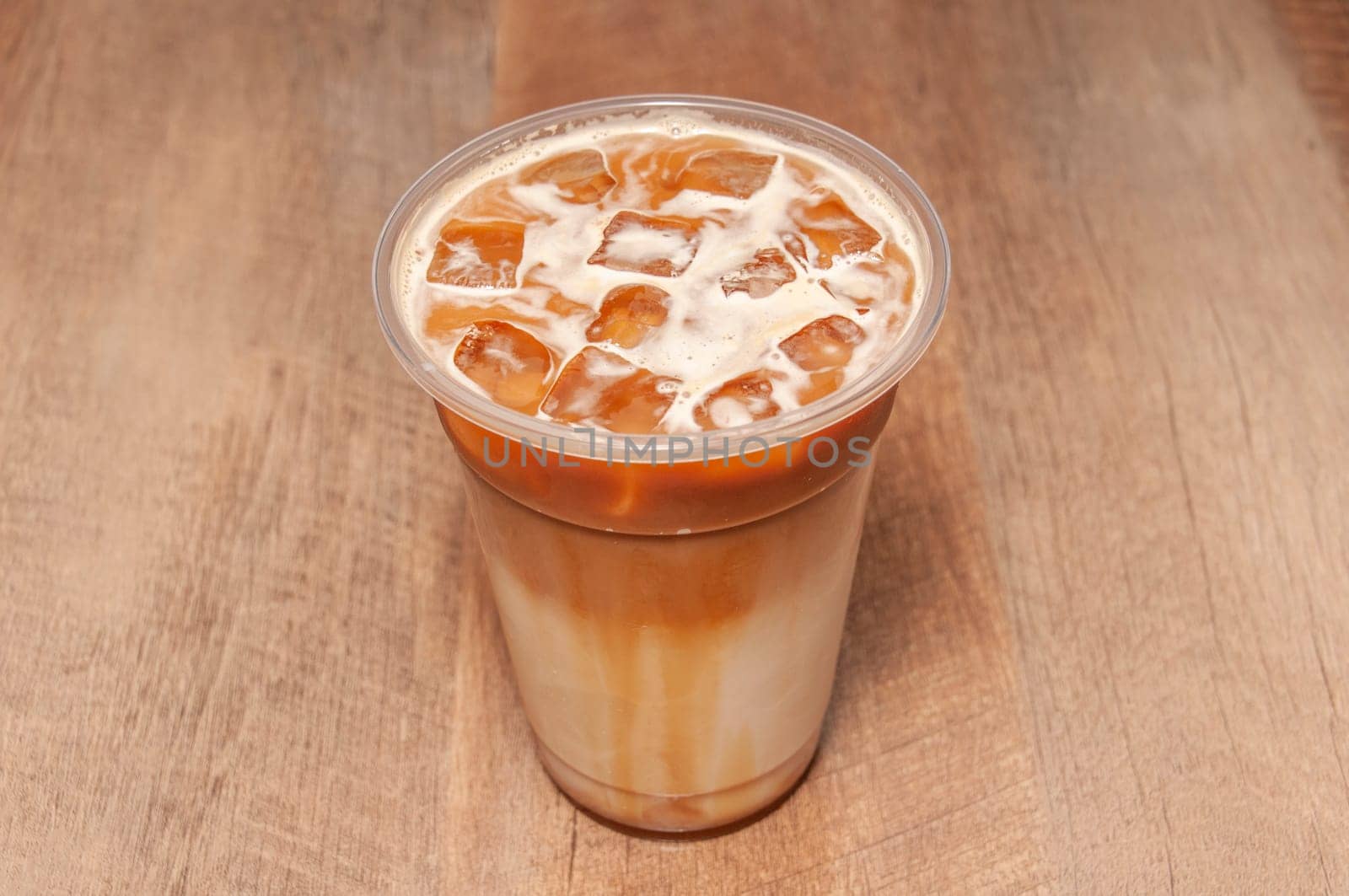 Delectable coffee drink known as iced Caramel Macchiato