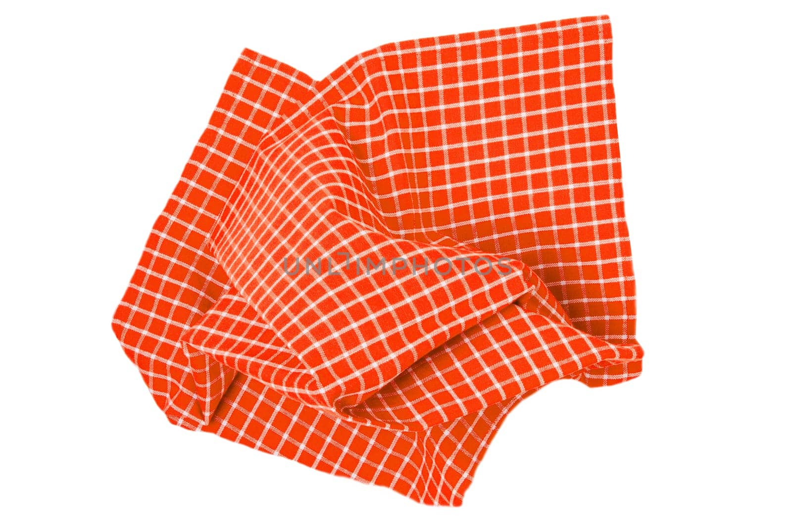 Closeup of a orange and white checkered napkin or tablecloth texture isolated on white background. Kitchen accessories.