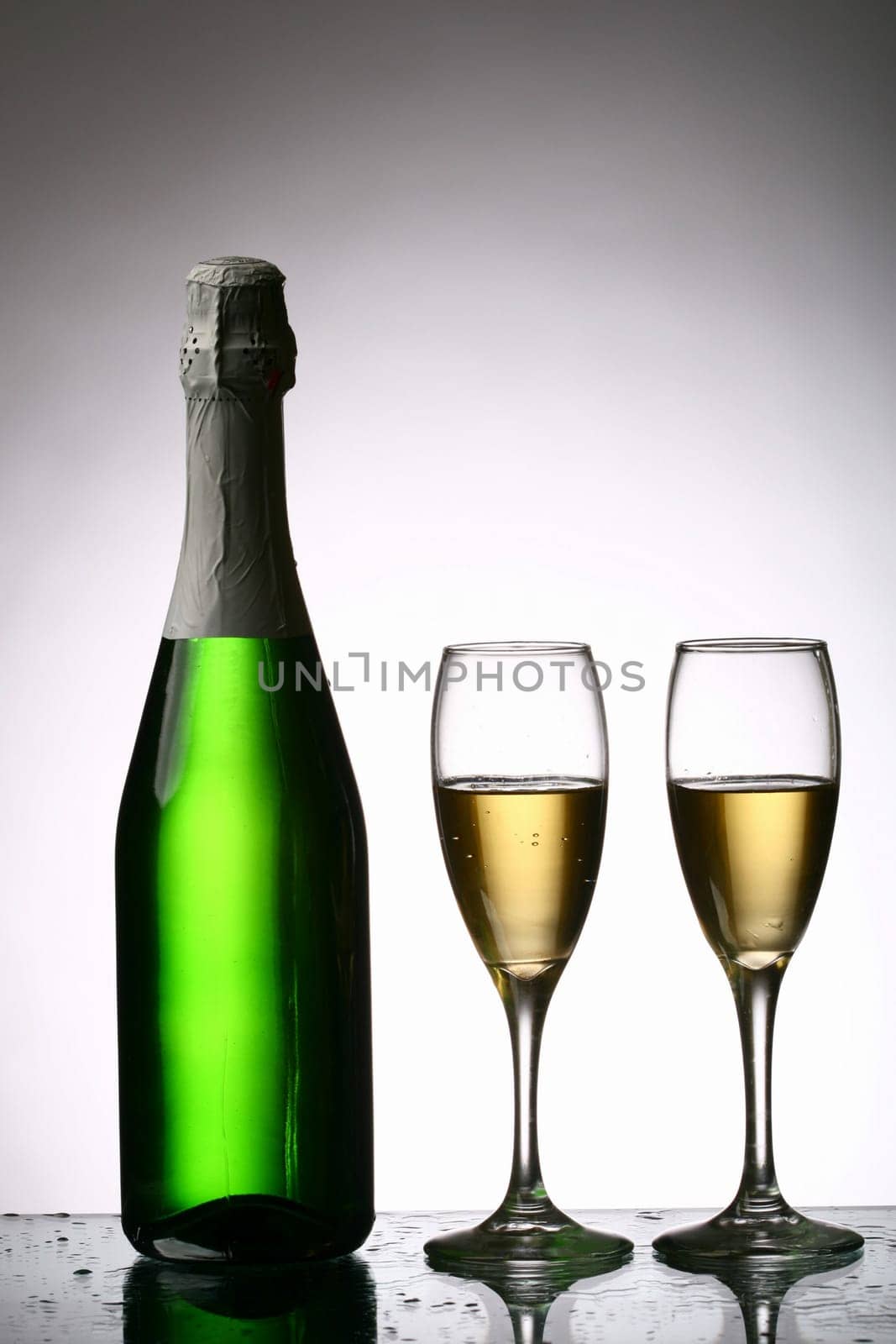 champagne with grape and the green bottle
