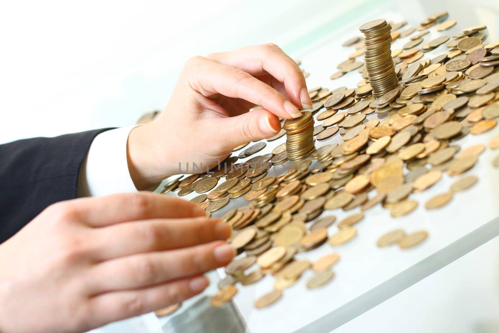 hand make coins piles on white background
