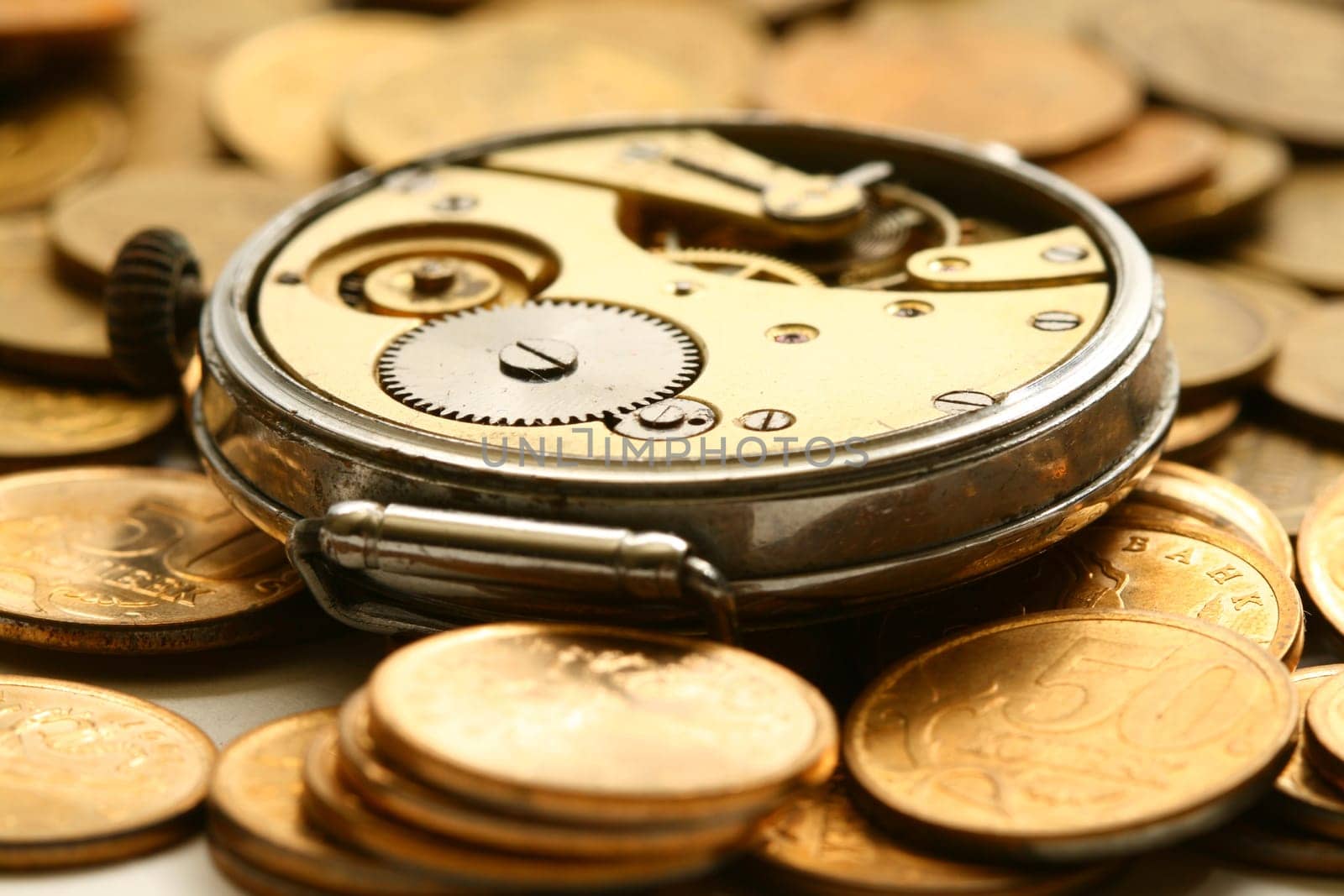 time is money coins and clock macro concept