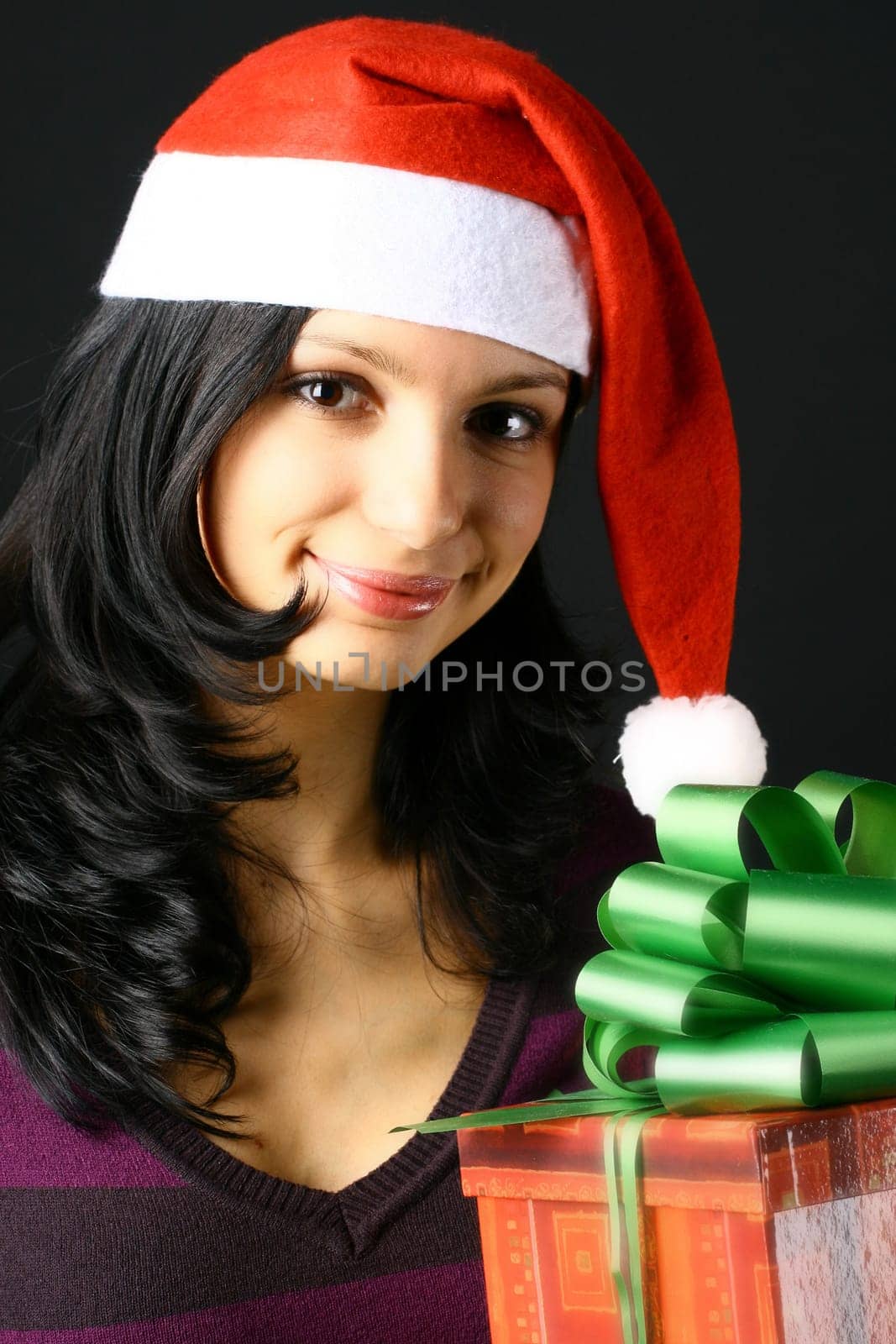 beautiful smiling young girl with christmas gifts