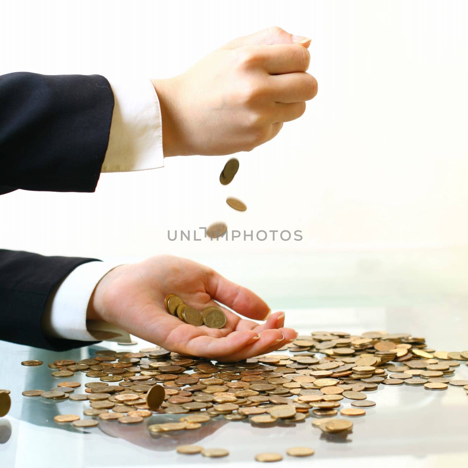 hand make coins rain on white background